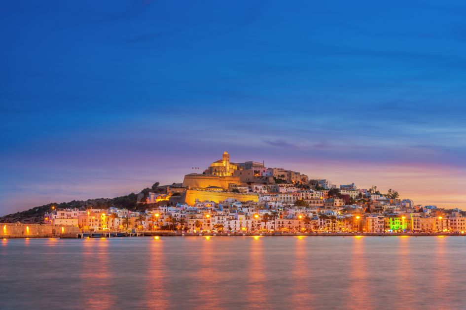 Ibiza town at sunset. Visit Eivissa when staying at a luxury villa in the Balearic Islands.