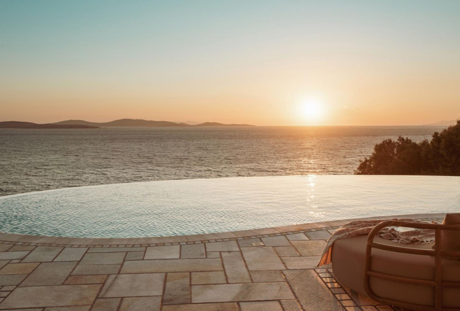 Sunset view over the pool and ocean at Villa Sunset Dream. A great view for some self catered alfresco dining in Mykonos.