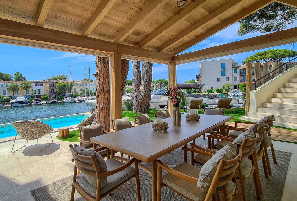 View of Port Grimaud in the background from the alfresco dining area of Villa My World in the foreground