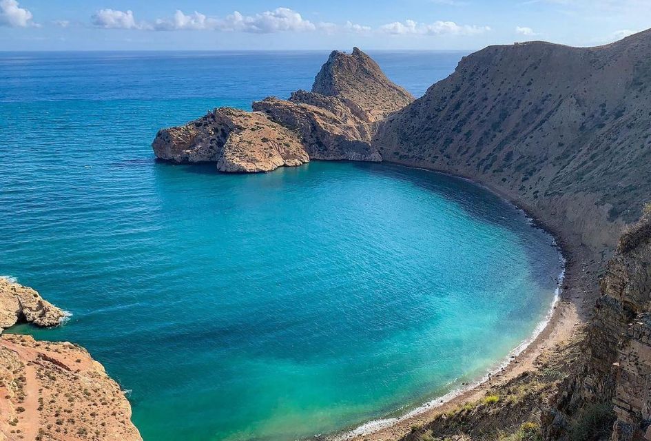 View over the blue waters of El Jebha Beach in Morocco.