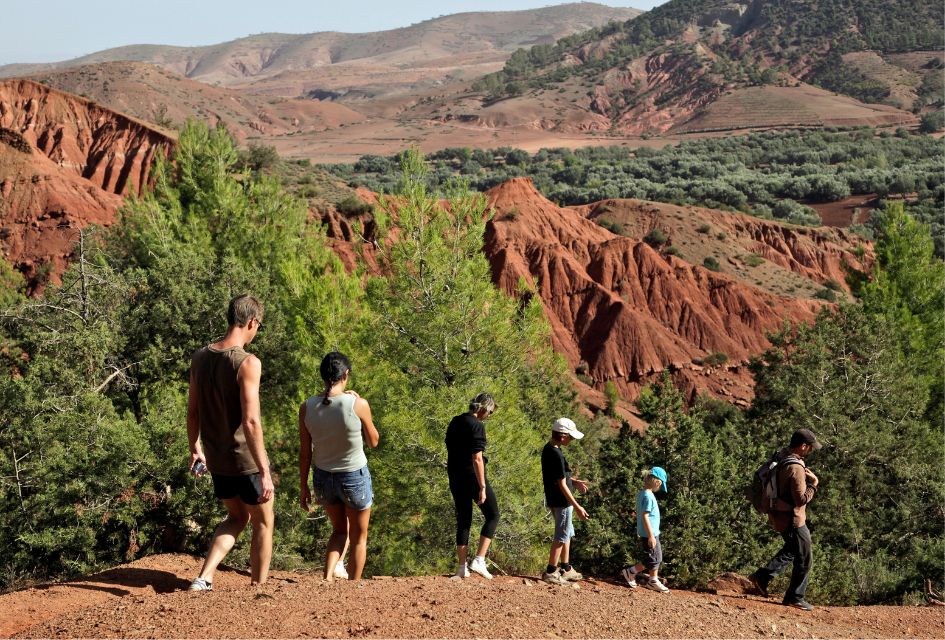 A family hiking across Morocco's Atlas Mountains, one of the best things to do when visiting Morocco in April!