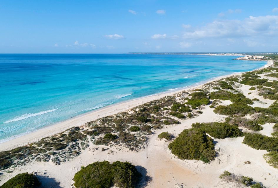 A view over the crystal clear waters and white sandy beach of Es Trenc in Mallorca.