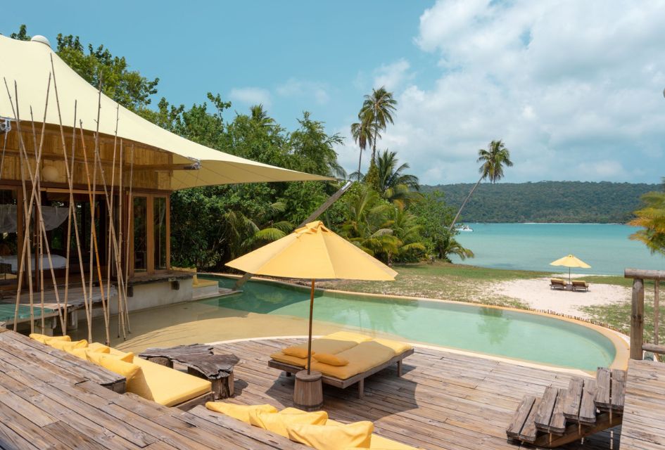 View from the pool terrace of the 2 Bedroom Beach Villa in Koh Kood, a stunning beach front villa in Thailand, with the azure waters of the ocean in the background.