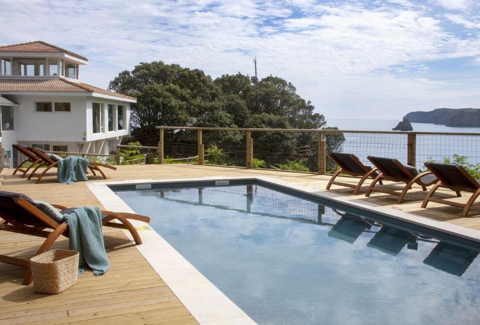 The luxury Spanish villa La Península in Cantabria, with a fabulous view of the water and cliffs from the swimming pool.